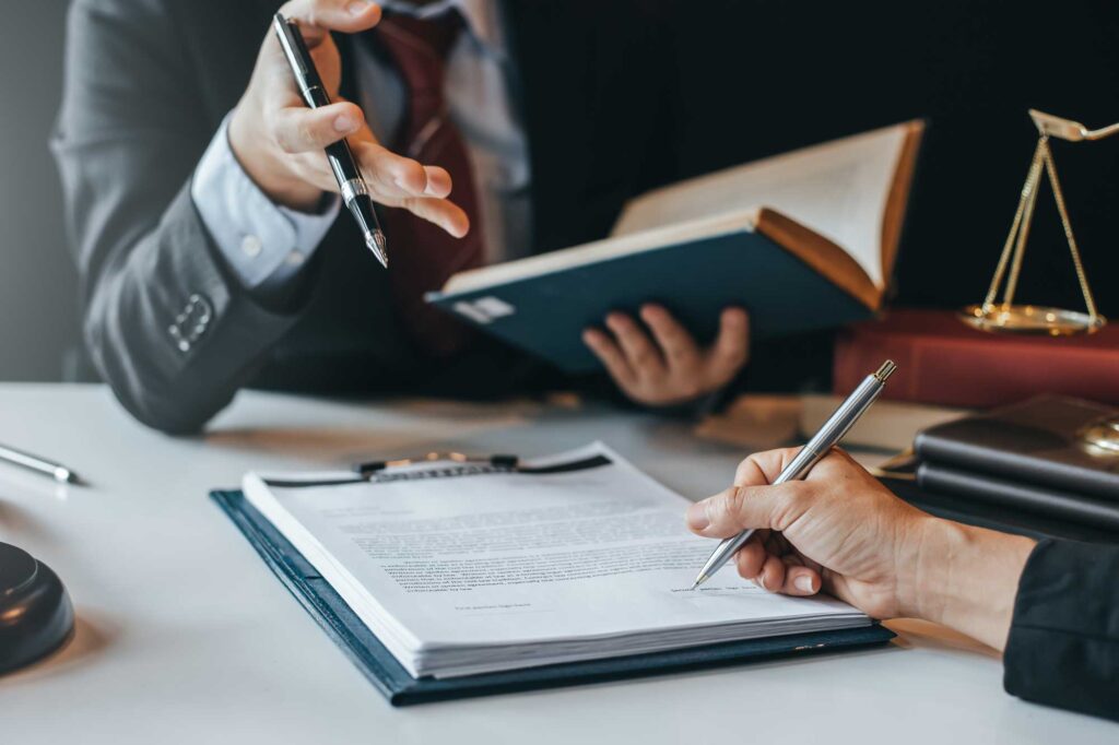 An open book and a clipboard with paper